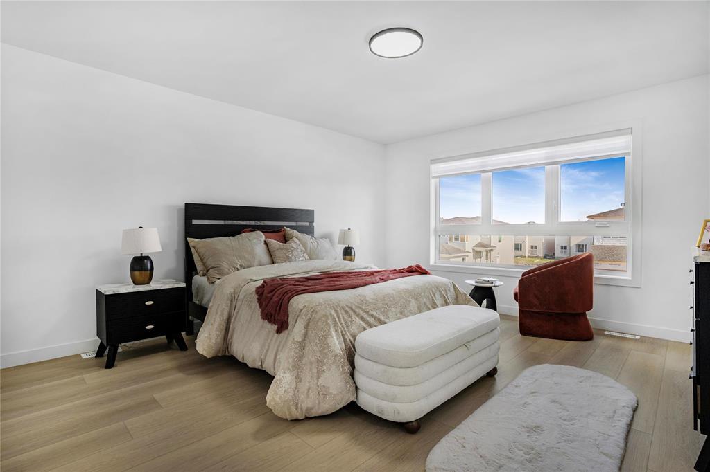 Primary bedroom with large window
